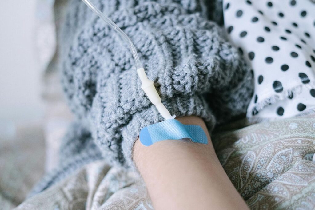 a woman undergoing intravenous therapy