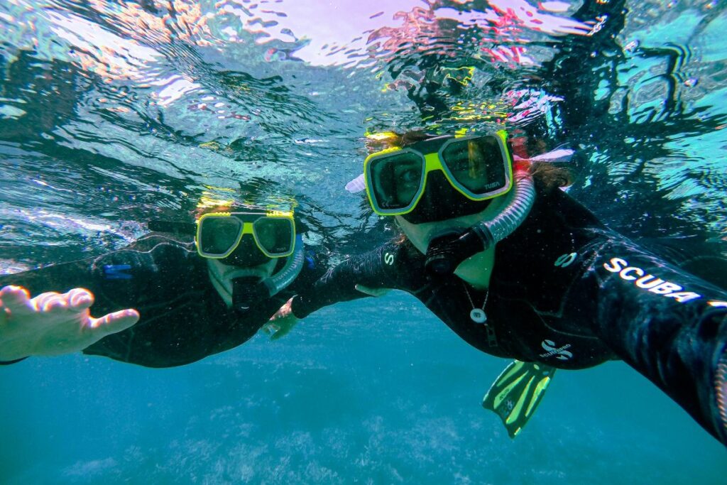 two person in scuba gear under water